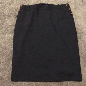 Grayish blue skirt with gold fashion buttons.